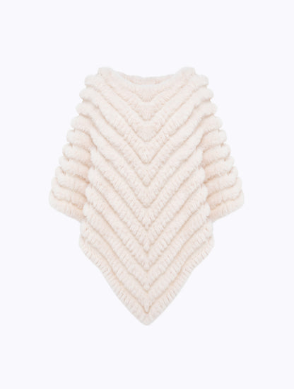 Poncho in faux fur con spilla