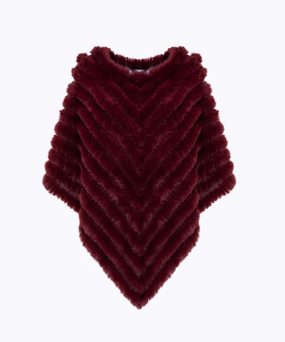 Poncho in faux fur con spilla